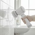 Cordless spin scrubber cleaning bathroom tile grout